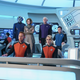 The cast of The Orville assembles on the ship's bridge.